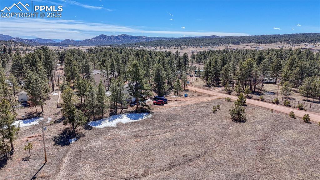 394 Due S Road Florissant, CO 80816 - Photo 10 of 28 a view of a city with lush green forest