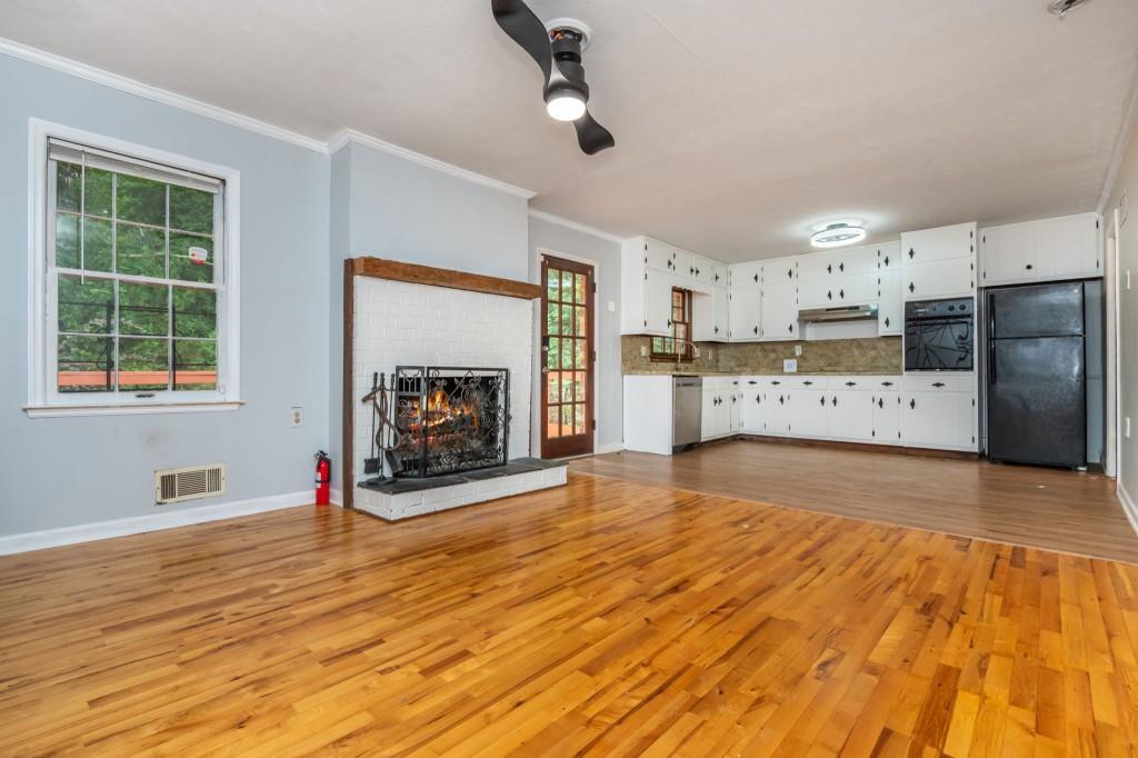 4043 Casa Loma Drive Decatur, GA 30034 - Photo 14 of 36 a view of a kitchen with a stove cabinets and wooden floor