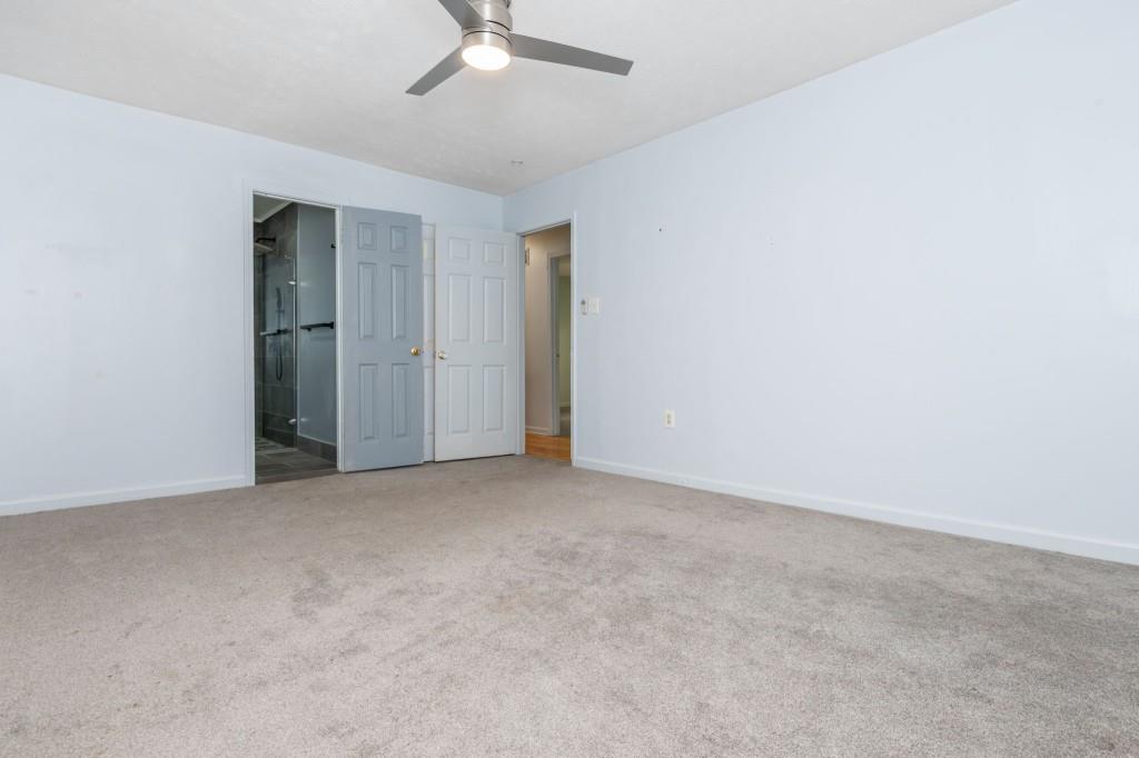 4043 Casa Loma Drive Decatur, GA 30034 - Photo 23 of 36 an empty room with a chandelier fan
