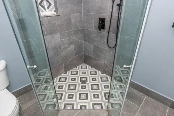 a bathroom with a shower and toilet
