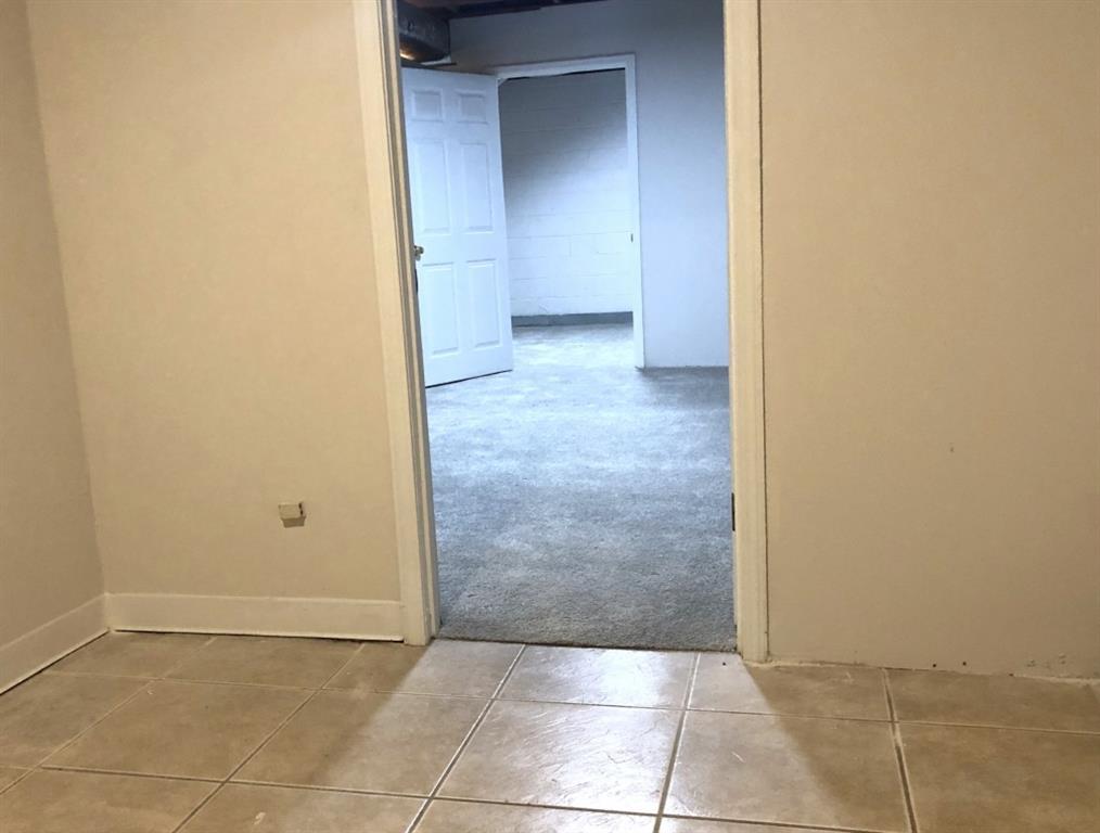 4043 Casa Loma Drive Decatur, GA 30034 - Photo 27 of 36 an empty room with a bench and cabinets