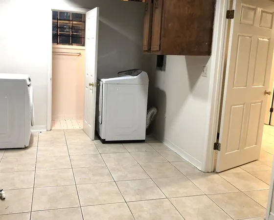 a view of a storage & utility room with washer and dryer