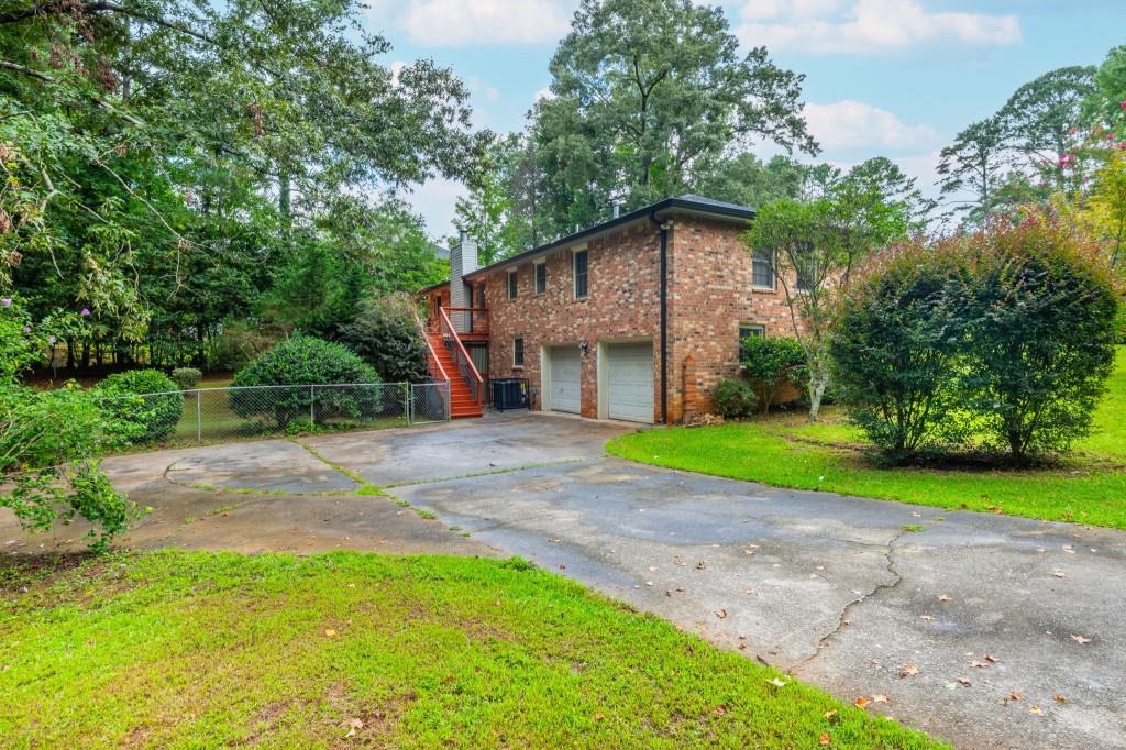 4043 Casa Loma Drive Decatur, GA 30034 - Photo 33 of 36 a view of a house with a yard and large trees