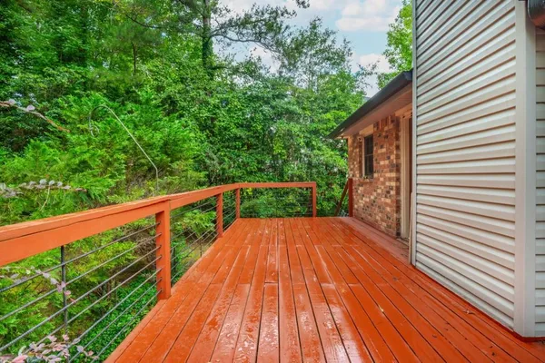 a view of balcony with wooden floor