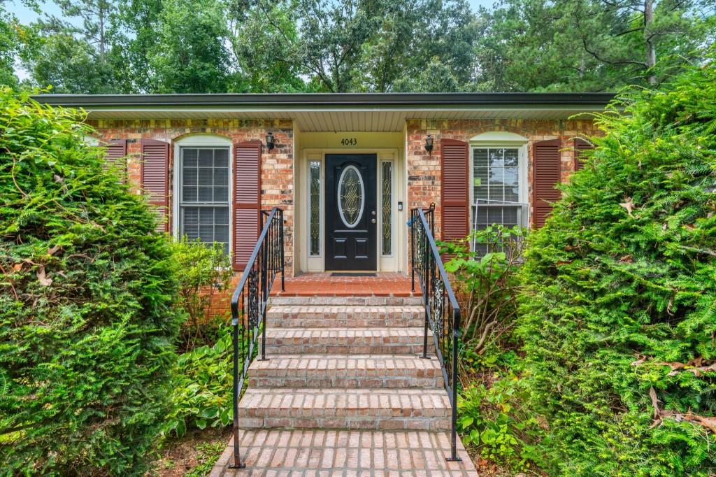 4043 Casa Loma Drive Decatur, GA 30034 - Photo 4 of 36 a view of a house with potted plants and a table and chairs