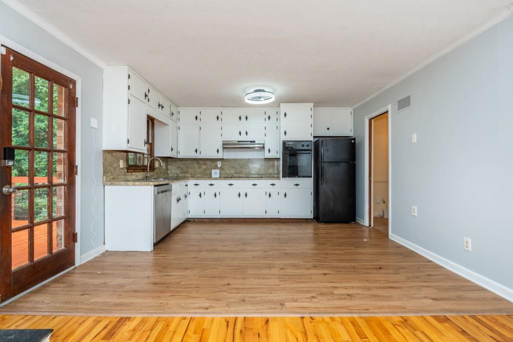 4043 Casa Loma Drive Decatur, GA 30034 - Photo 9 of 36 a view of a kitchen with wooden floor and electronic appliances