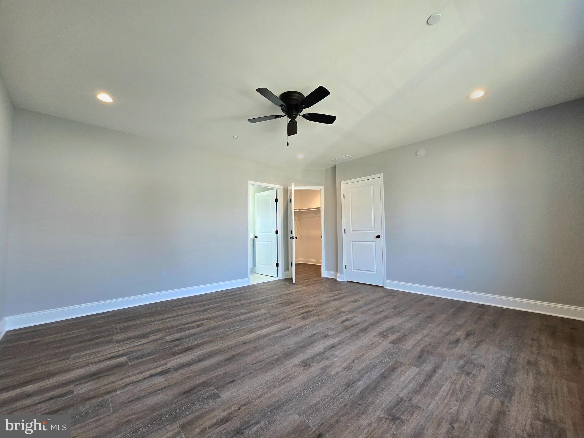 7704 Highpoint Road Clearwater Beach, MD 21226 - Photo 11 of 48 wooden floor in an empty room with a window