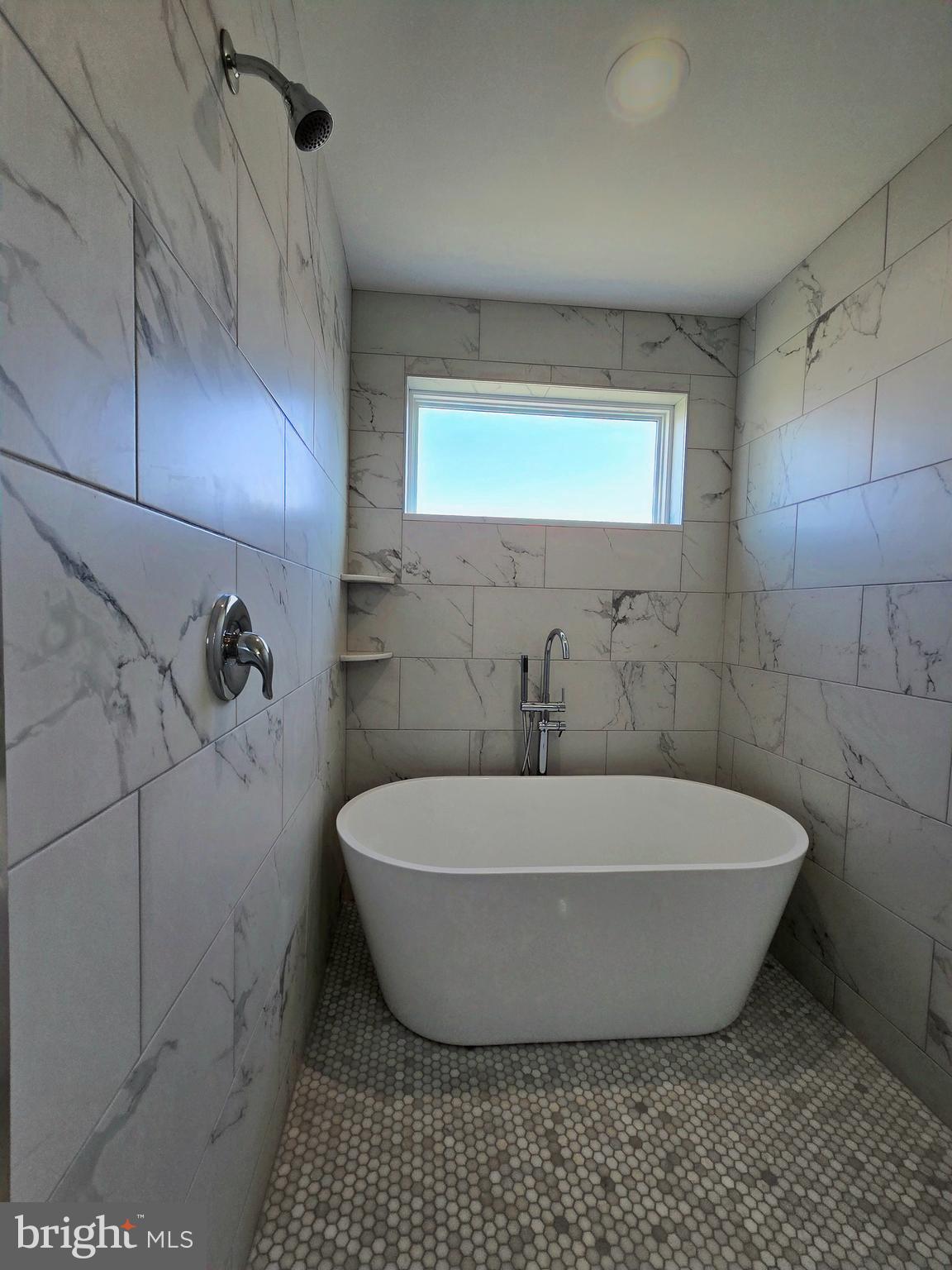 7704 Highpoint Road Clearwater Beach, MD 21226 - Photo 15 of 48 a white bath tub sitting in a bathroom