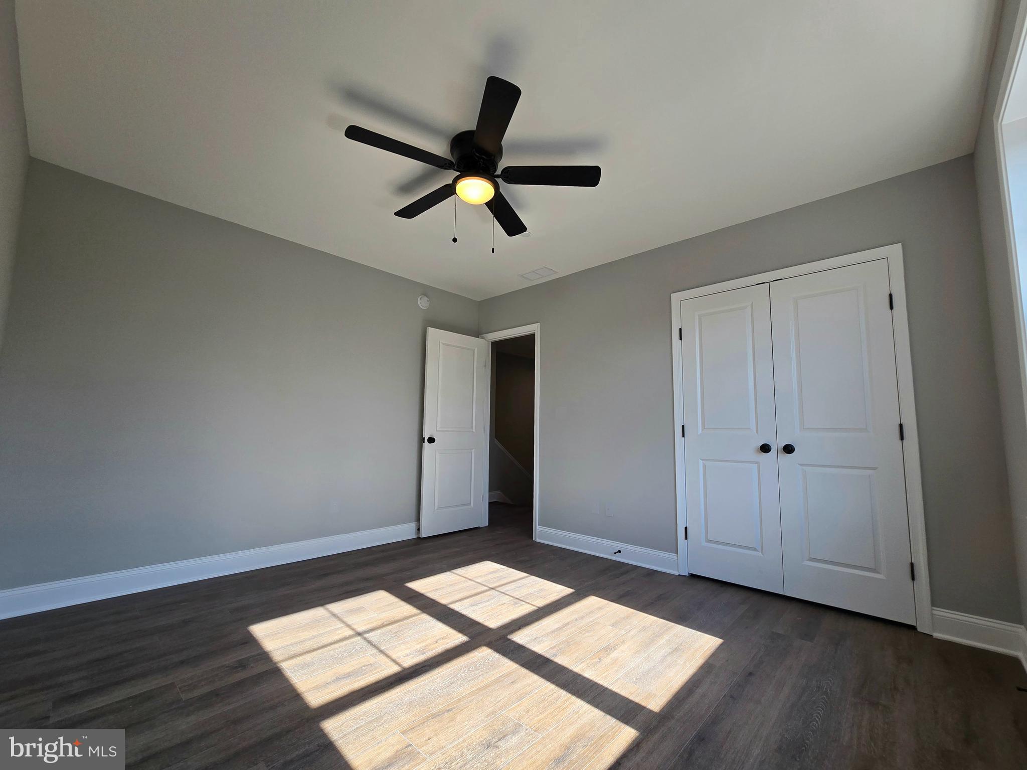 7704 Highpoint Road Clearwater Beach, MD 21226 - Photo 17 of 48 a view of empty room with wooden floor and window