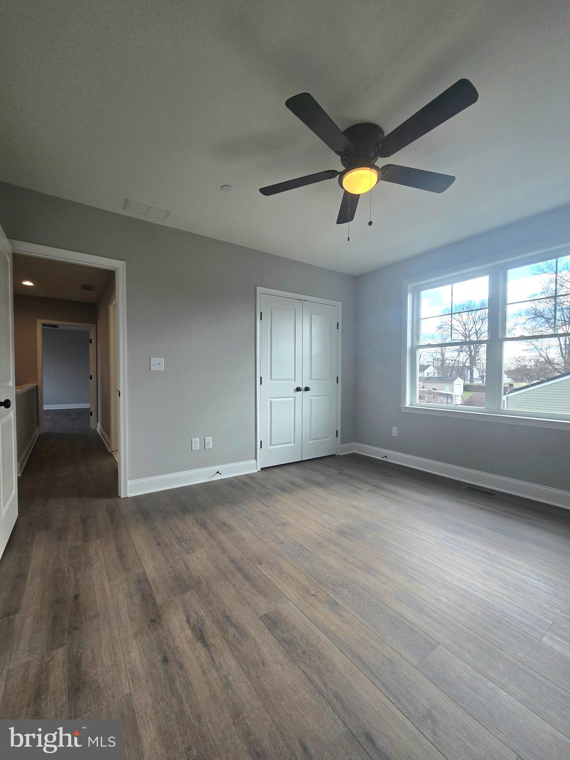 7704 Highpoint Road Clearwater Beach, MD 21226 - Photo 18 of 48 an empty room with a window and a ceiling fan