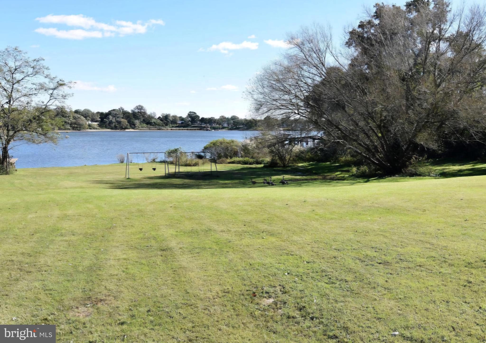 7704 Highpoint Road Clearwater Beach, MD 21226 - Photo 38 of 48 a view of a lake with houses in the back