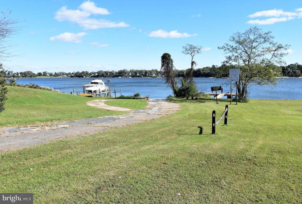 7704 Highpoint Road Clearwater Beach, MD 21226 - Photo 41 of 48 a view of a lake with a yard