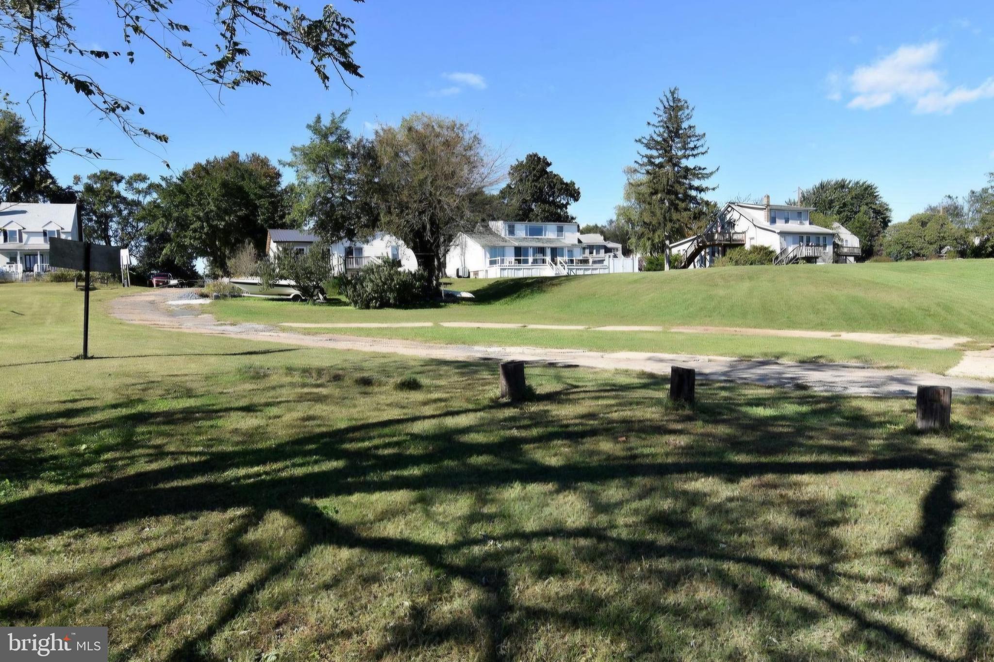 7704 Highpoint Road Clearwater Beach, MD 21226 - Photo 42 of 48 a view of a swimming pool and a yard