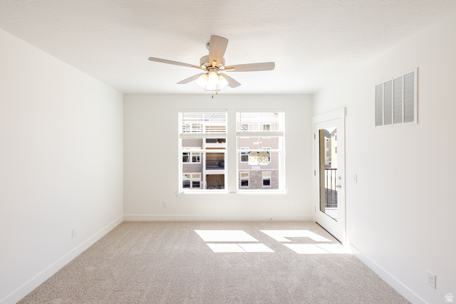 4664 South 680th West, Unit S201 Mapleton, UT 84664 - Photo 15 of 16 Room with light beige carpet, white walls, and a ceiling fan