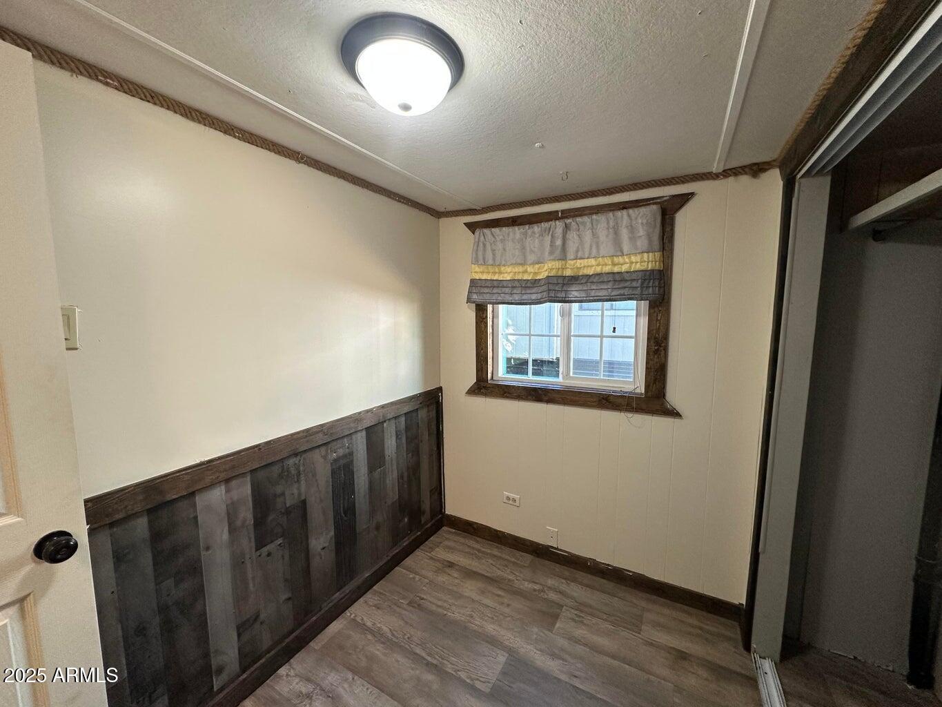 4230 North Az Highway Pine, AZ 85544 - Photo 5 of 15 a view of an empty room with wooden floor and a window
