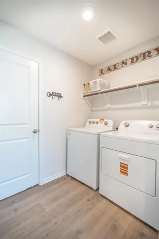 a utility room with washer and dryer