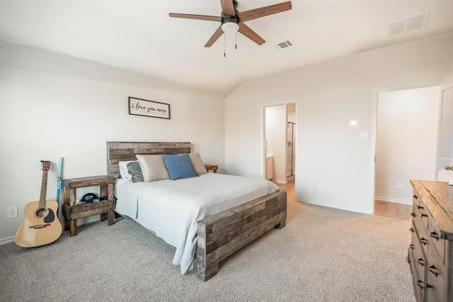 a bed room with a bed and a window