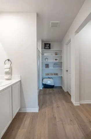 a view of a storage & utility room with washing machine