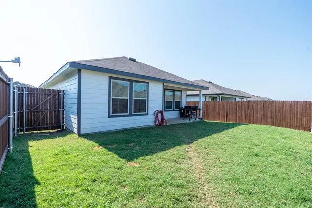 a view of a backyard with a garden and plants