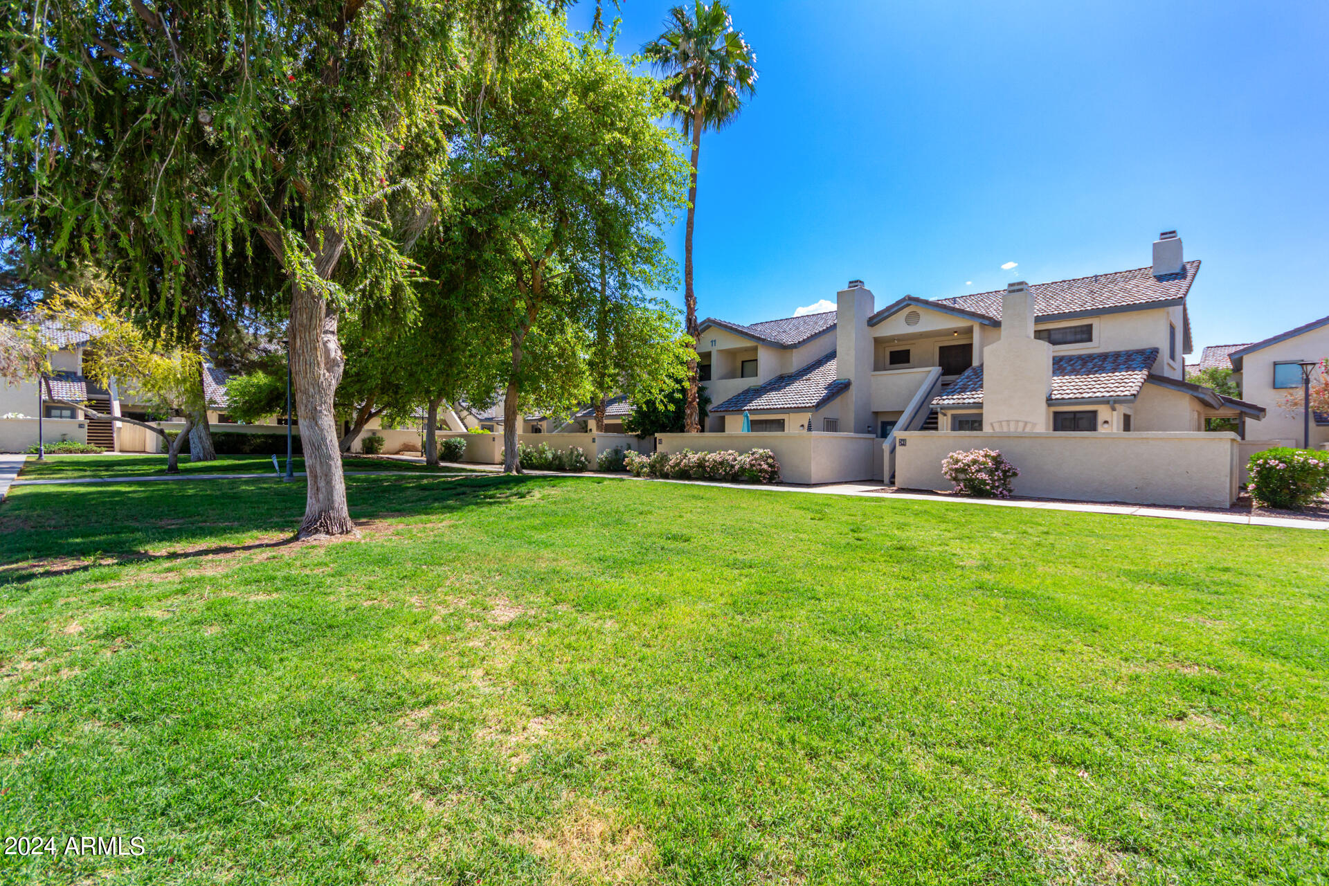 1222 West Baseline Road, Unit 240 Tempe, AZ 85283 - Photo 1 of 36 a view of a house with a big yard