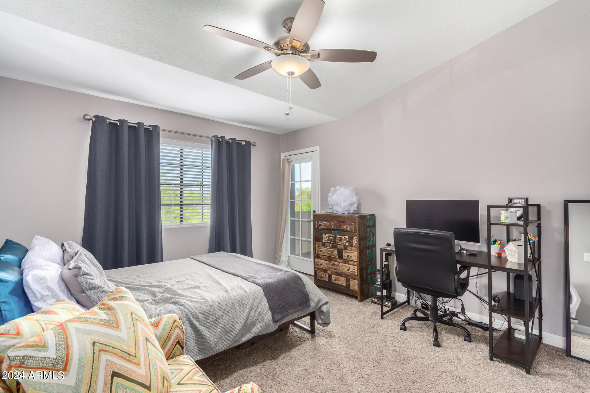 1222 West Baseline Road, Unit 240 Tempe, AZ 85283 - Photo 16 of 36 a bedroom with a large bed and a window
