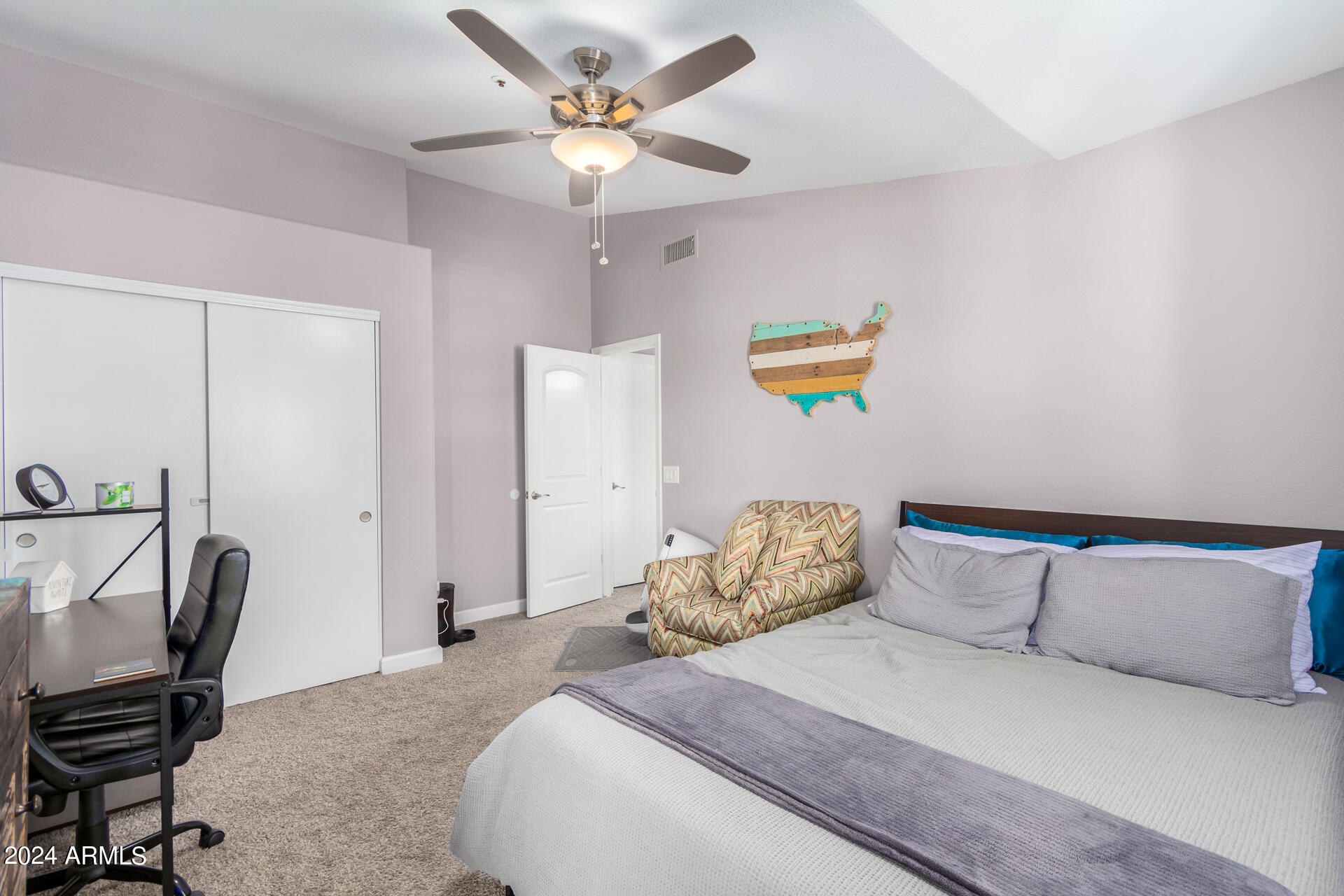 1222 West Baseline Road, Unit 240 Tempe, AZ 85283 - Photo 17 of 36 a bedroom with a bed a desk and chair
