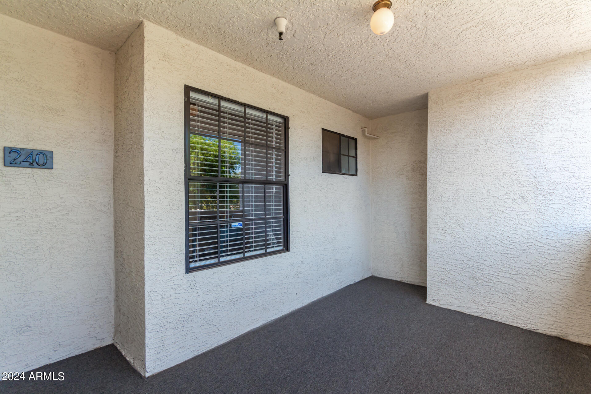 1222 West Baseline Road, Unit 240 Tempe, AZ 85283 - Photo 22 of 36 a view of an empty room with a window