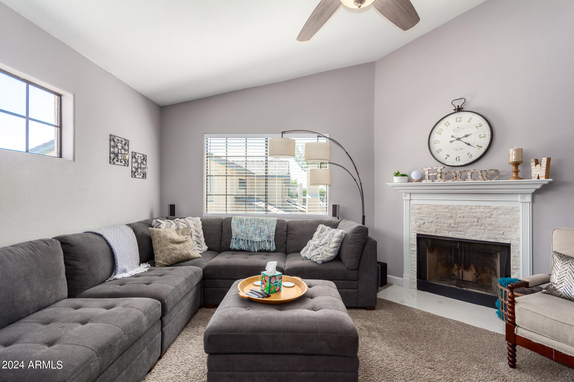 1222 West Baseline Road, Unit 240 Tempe, AZ 85283 - Photo 2 of 36 a living room with furniture and a fireplace
