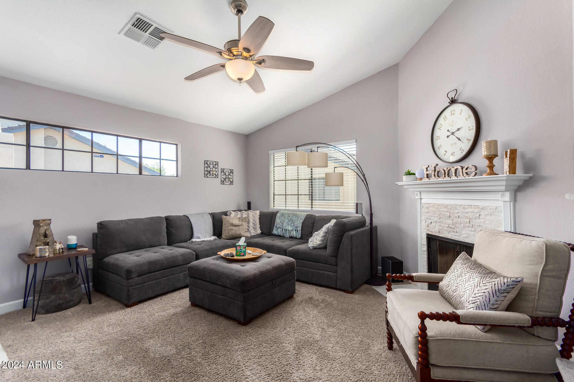 1222 West Baseline Road, Unit 240 Tempe, AZ 85283 - Photo 3 of 36 a living room with furniture a fireplace and a large window