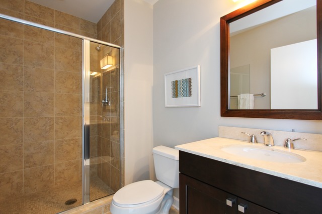 1211 South Prairie Avenue, Unit 5202 Chicago, IL 60605 - Photo 14 of 22 a bathroom with a sink a toilet and shower