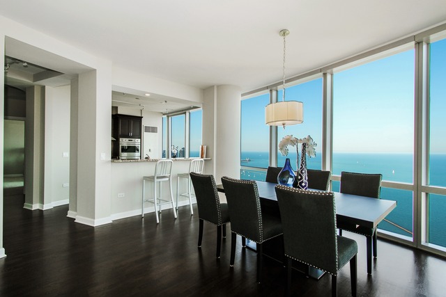 1211 South Prairie Avenue, Unit 5202 Chicago, IL 60605 - Photo 6 of 22 a view of a dining room with furniture window and wooden floor
