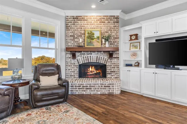 a kitchen with white cabinets and sink