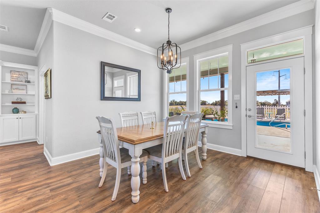 1694 Henry Prairie Road Franklin, TX 77856 - Photo 15 of 40 a view of a dining room with furniture window and wooden floor
