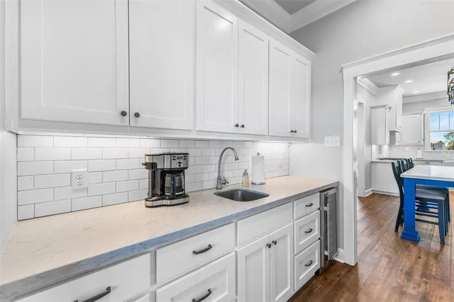 a bedroom with a large bed and a large window