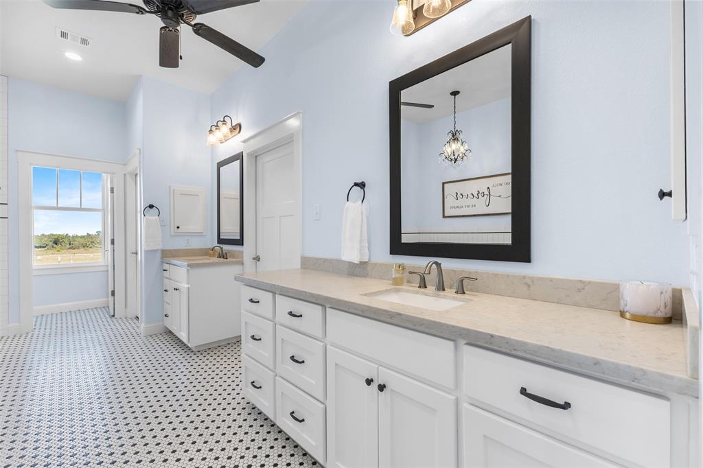 1694 Henry Prairie Road Franklin, TX 77856 - Photo 26 of 40 a spacious bathroom with a shower a sink and a mirror