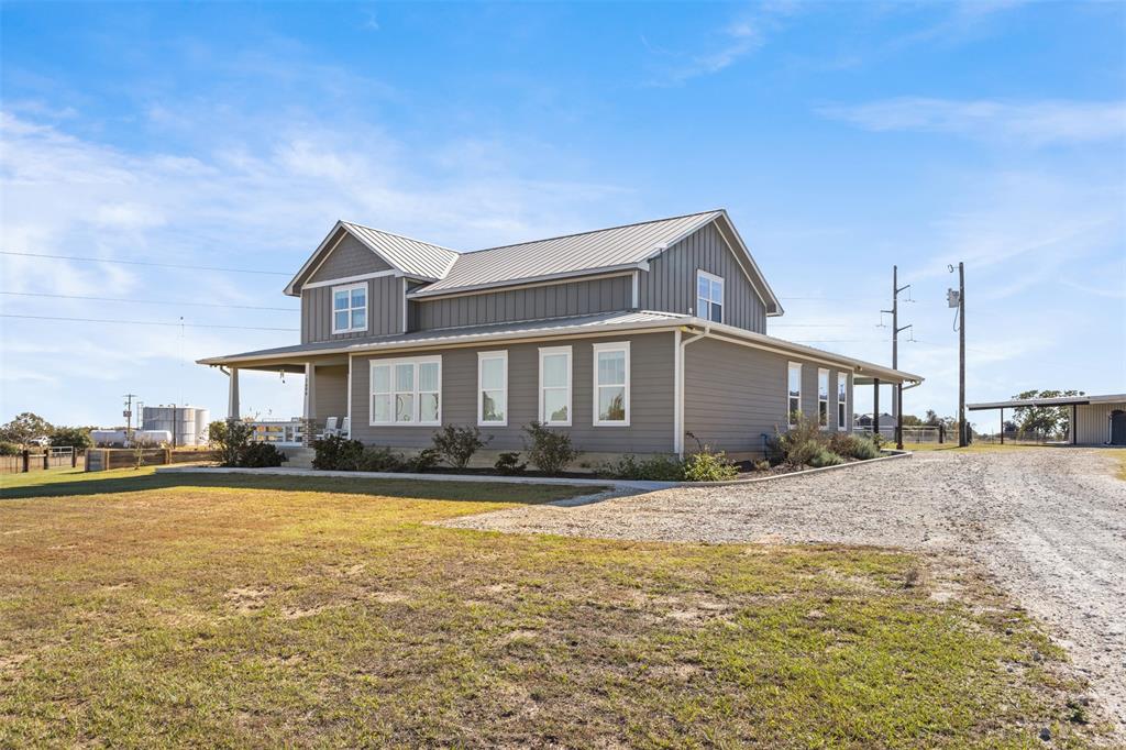 1694 Henry Prairie Road Franklin, TX 77856 - Photo 7 of 40 a front view of a house with a yard
