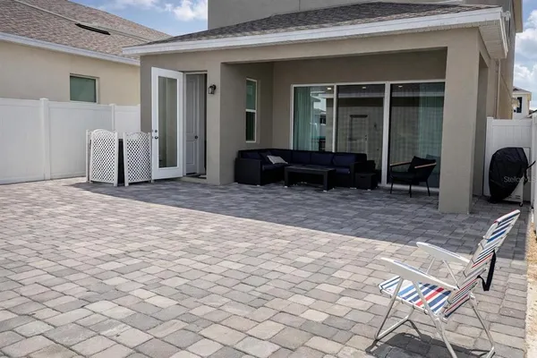 a bedroom with two beds and a large window