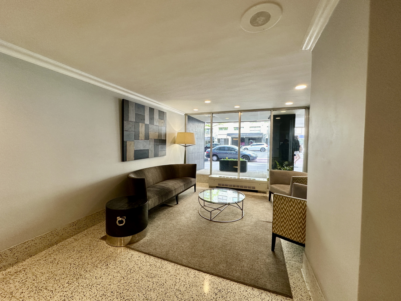 220 East 57th Street, Unit 4C Manhattan, NY 10022 - Photo 11 of 12 a living room with furniture and a wooden floor