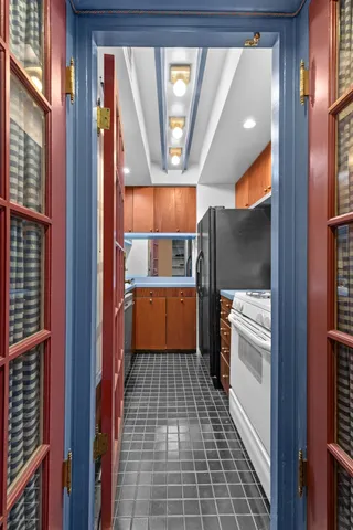 a kitchen with a refrigerator a sink and dishwasher
