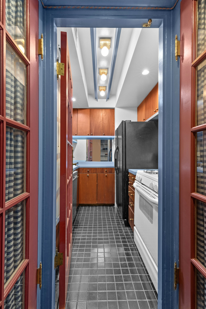 220 East 57th Street, Unit 4C Manhattan, NY 10022 - Photo 9 of 12 a kitchen with a refrigerator a sink and dishwasher