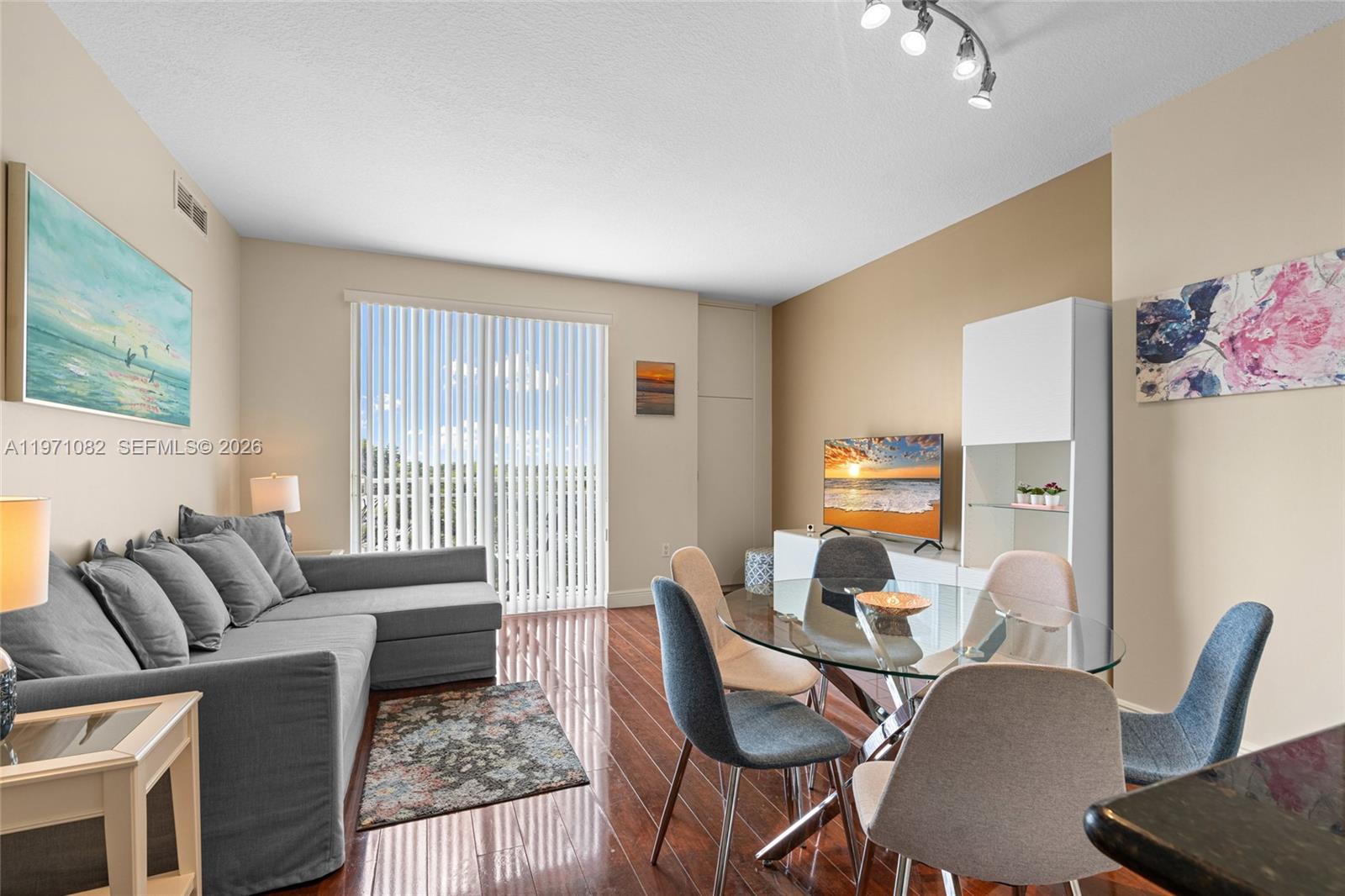 7275 Southwest 90th Way, Unit 404 Miami, FL 33156 - Photo 8 of 35 a living room with furniture and a large window