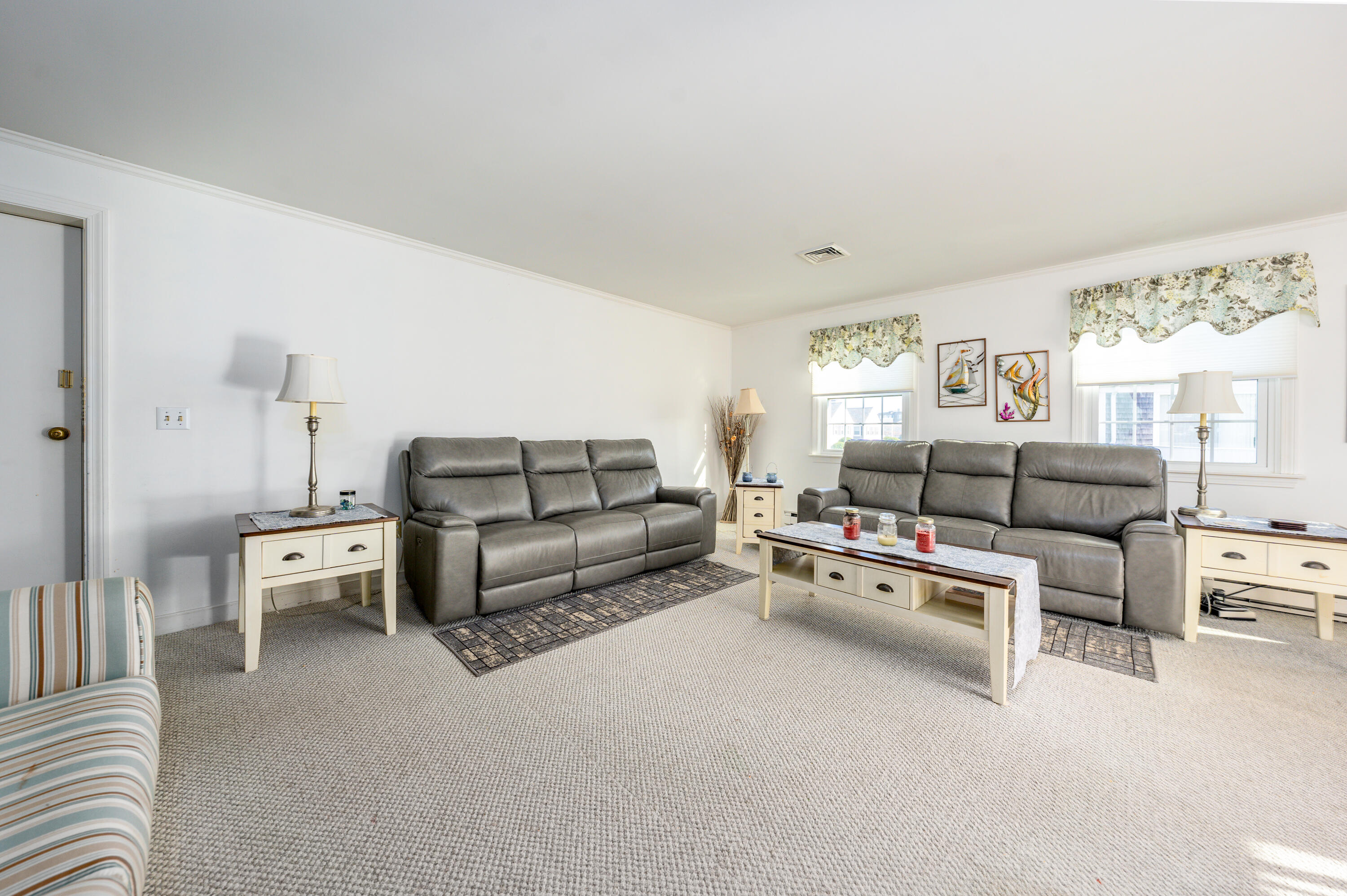 36 Belmont Road, Unit USW21 West Harwich, MA 02671 - Photo 11 of 20 a living room with furniture white walls and a large window