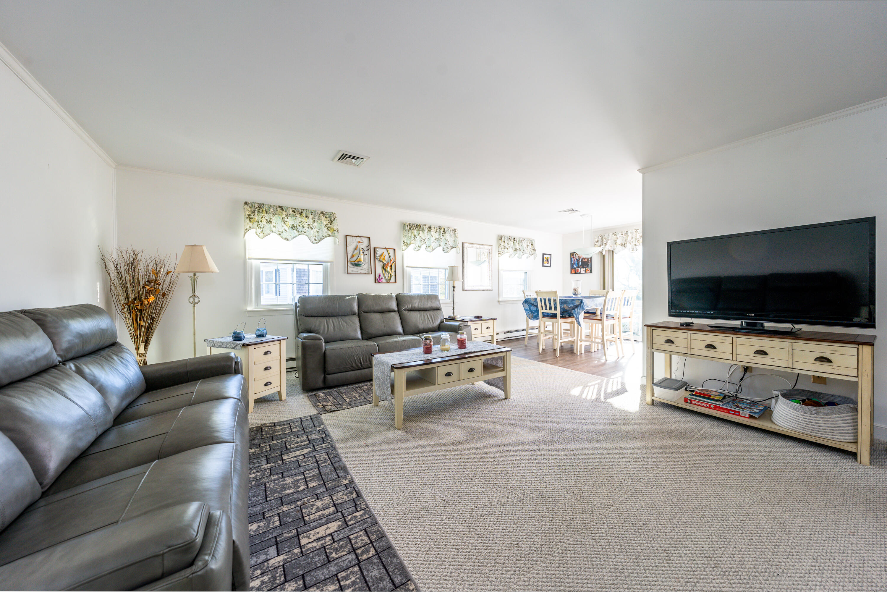36 Belmont Road, Unit USW21 West Harwich, MA 02671 - Photo 12 of 20 a living room with furniture and a flat screen tv
