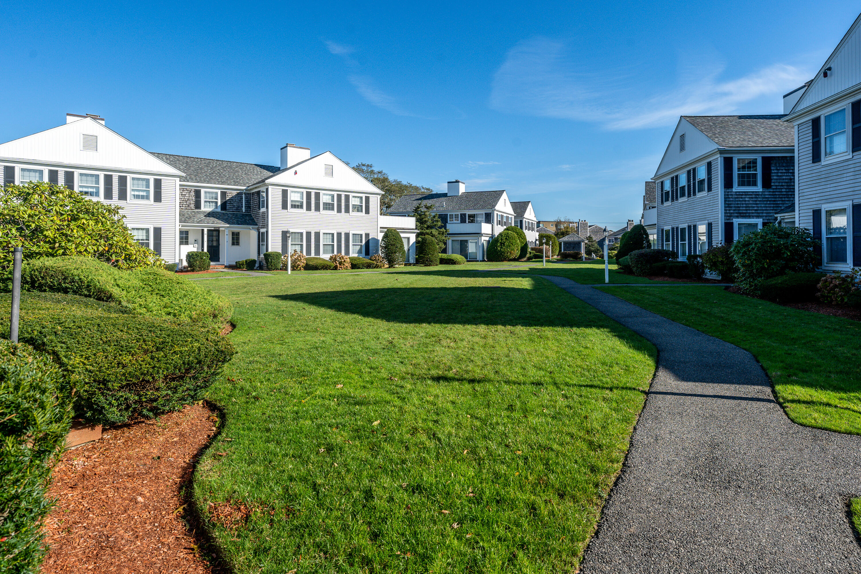 36 Belmont Road, Unit USW21 West Harwich, MA 02671 - Photo 3 of 20 a view of a big house with a big yard and potted plants