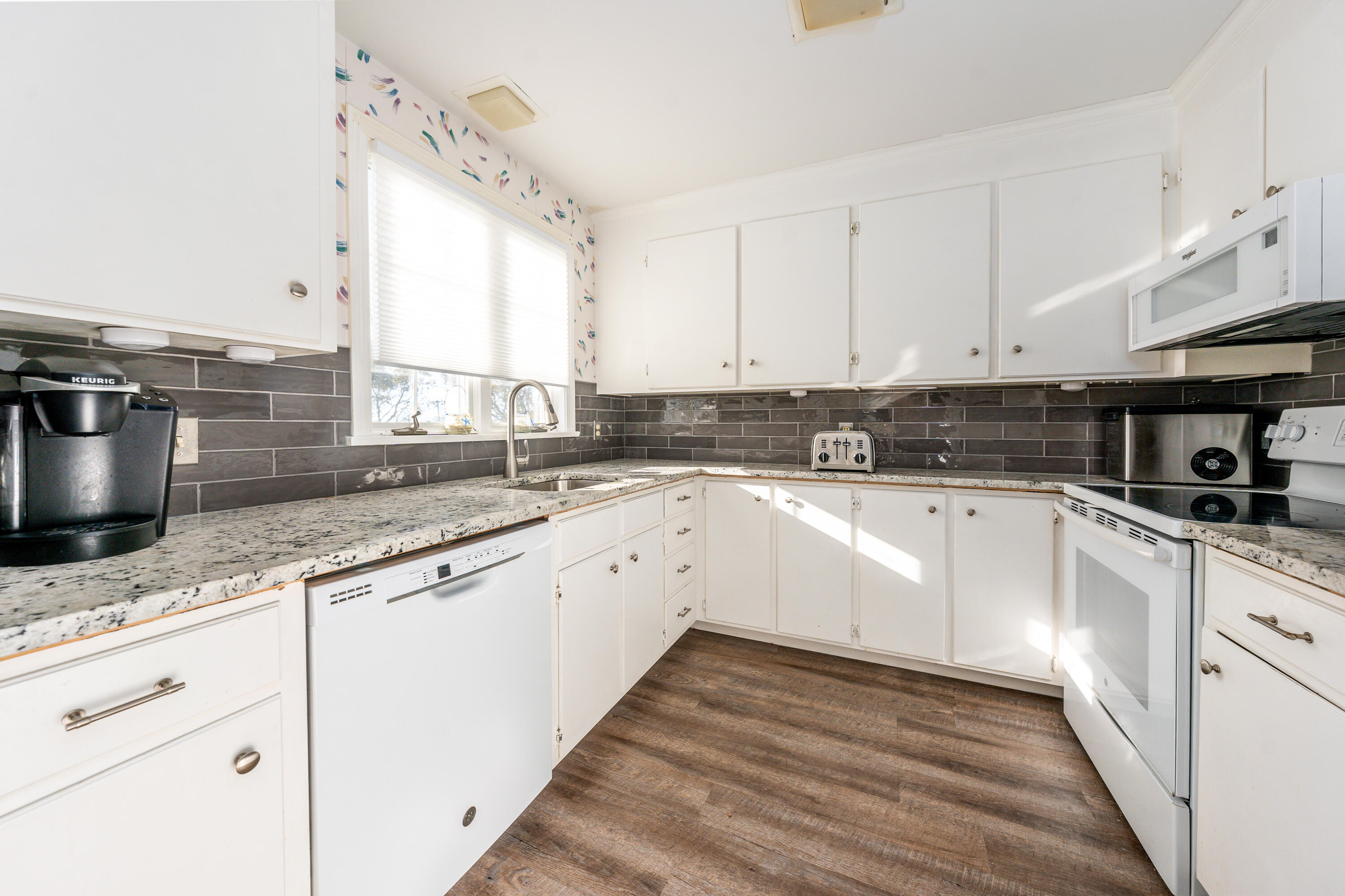 36 Belmont Road, Unit USW21 West Harwich, MA 02671 - Photo 6 of 20 a large kitchen with granite countertop a sink a stove and cabinets