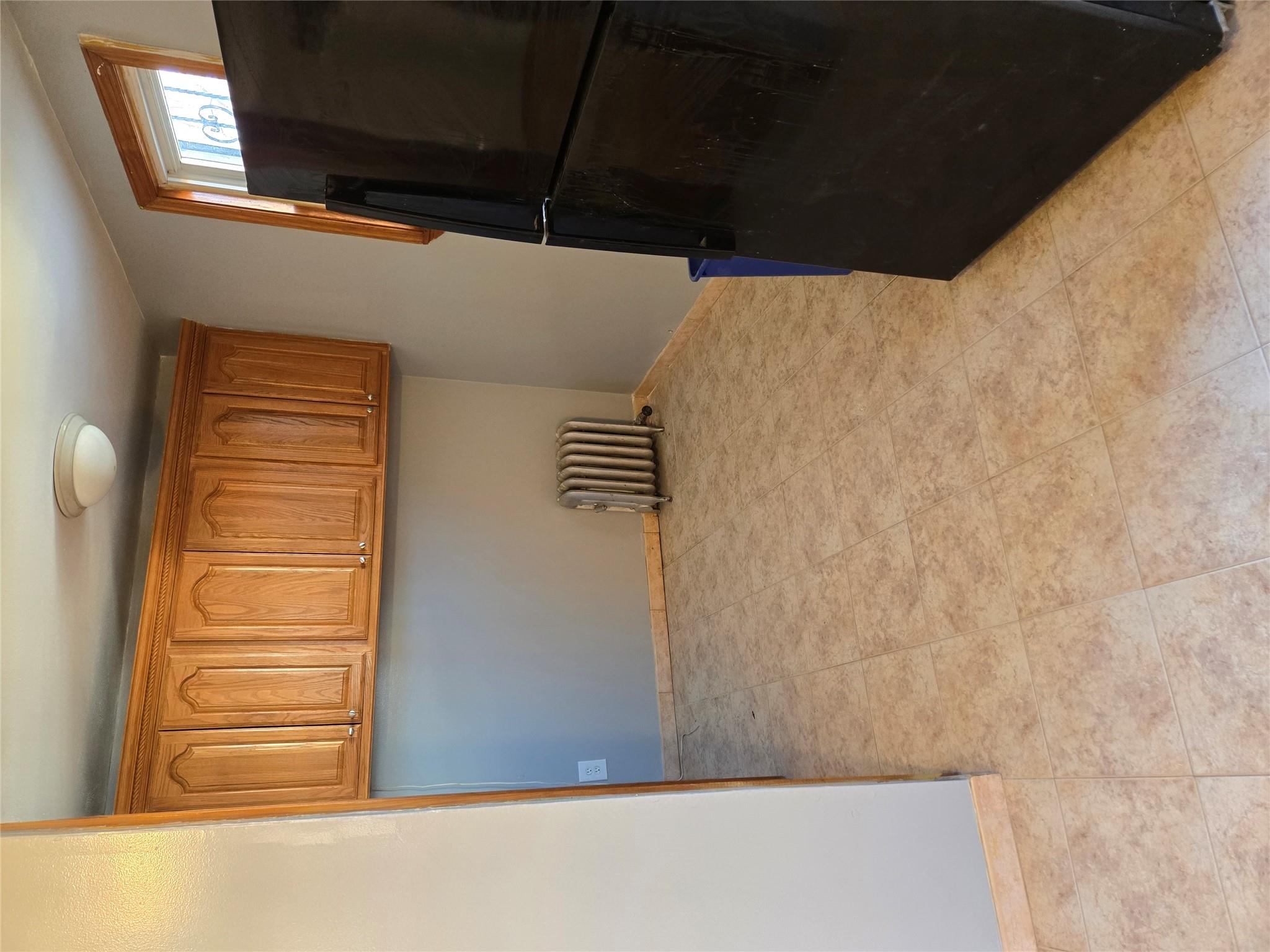 189-07 Quencer Road Queens, NY 11412 - Photo 11 of 36 a view of kitchen with refrigerator