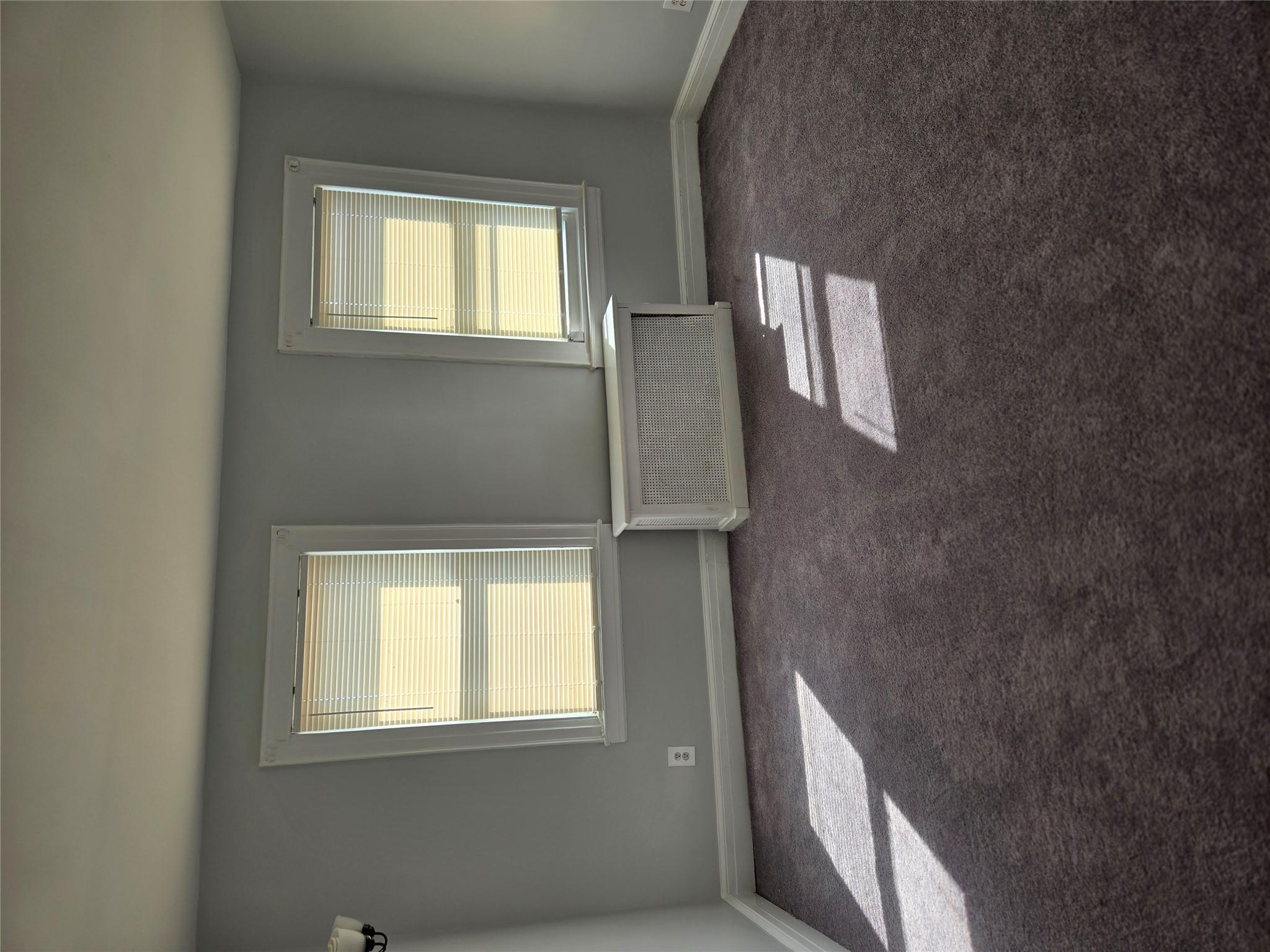 189-07 Quencer Road Queens, NY 11412 - Photo 17 of 36 an empty room with a window