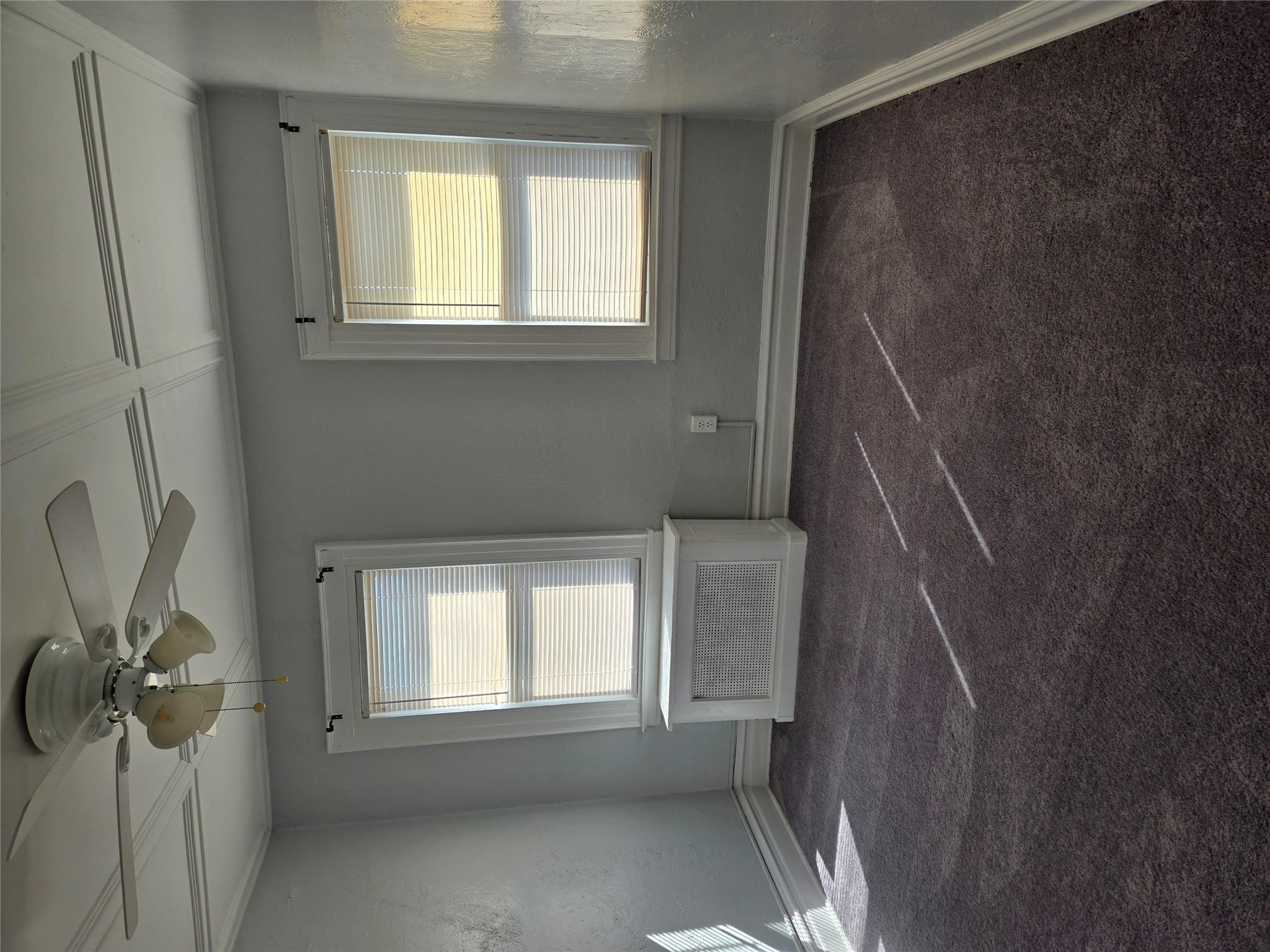 189-07 Quencer Road Queens, NY 11412 - Photo 19 of 36 a view of an empty room with a window