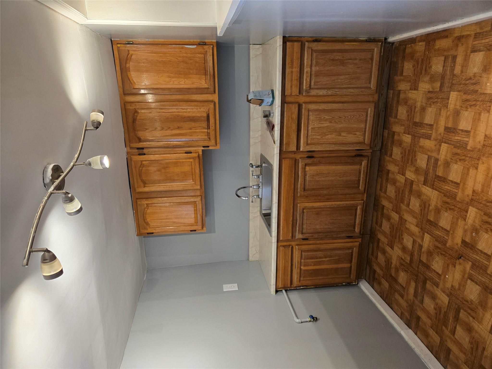 189-07 Quencer Road Queens, NY 11412 - Photo 27 of 36 a view of cabinets a sink and a window