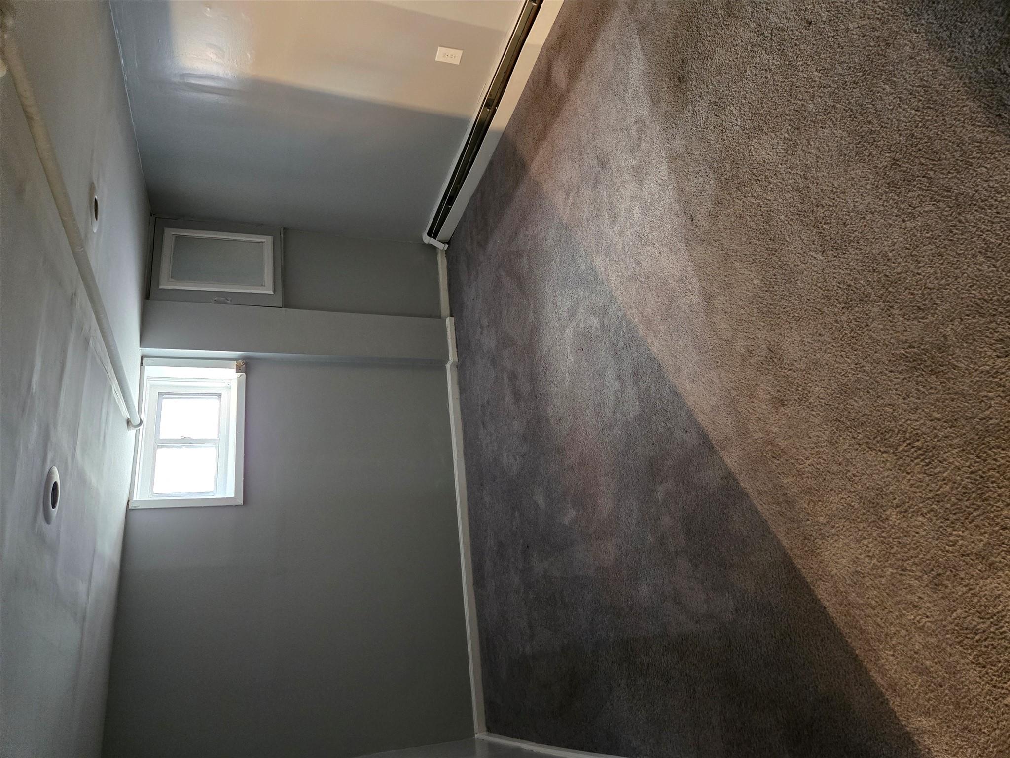 189-07 Quencer Road Queens, NY 11412 - Photo 28 of 36 a view of an empty room with a window